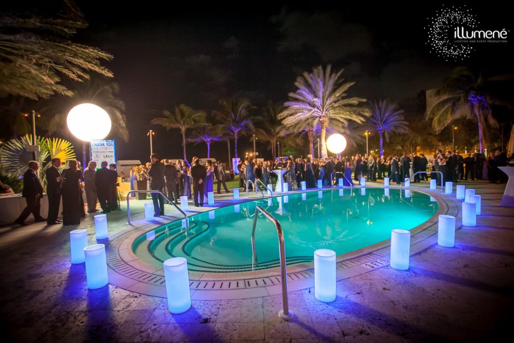 Airstars and large wax luminaries for a corporate event Miami